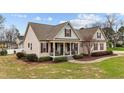 Beautiful single-Gathering home boasting a well-maintained lawn, mature trees, and charming curb appeal at 225 Woodfield Ct, Fuquay Varina, NC 27526