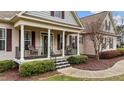 Charming home featuring a cozy front porch, perfect for relaxing and enjoying the outdoors at 225 Woodfield Ct, Fuquay Varina, NC 27526