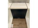 A selection of tile samples including flooring, dark cabinet, and white countertops at 239 Meadowbark Bnd # 27, Garner, NC 27529