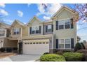 Charming two-story home with a two-car garage and manicured front yard landscaping at 241 Westgrove Ct, Durham, NC 27703