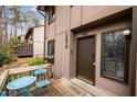 Charming townhome entrance with a welcoming front porch and manicured flower box at 3080 Colony Rd # A, Durham, NC 27705