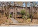 View of the exterior featuring mature trees and landscaping around the property at 3080 Colony Rd # A, Durham, NC 27705