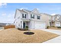 Charming home with light gray siding, black shutters, well-maintained lawn, and adjacent home at 3103 Woodland Park Rd, Durham, NC 27703