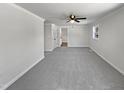 Spacious bedroom featuring neutral walls and carpet, ceiling fan, and a window providing natural light at 317 Gary St, Raleigh, NC 27606