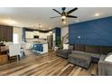 Open-concept living area with modern decor, wood floors, and ample natural light at 372 White Oak Ridge Dr, Garner, NC 27529