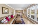 Cozy living room with hardwood floors, tan walls, and a large window letting in natural light at 401 Fletcher Dr, Raleigh, NC 27603