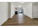 Open living room with fireplace and sliding glass doors at 7818 Spungold St, Raleigh, NC 27617