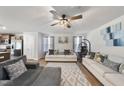 Bright and airy living room with a ceiling fan and stylish decor at 8710 Kenridge Ln, Fuquay Varina, NC 27526