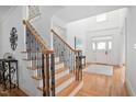 Bright foyer showcasing hardwood floors, a staircase with iron spindles, and a grand entrance at 921 Alden Bridge Dr, Cary, NC 27519