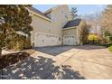Spacious three-car garage with an extended driveway, providing ample parking and storage space at 921 Alden Bridge Dr, Cary, NC 27519