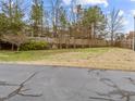 Spacious backyard with a well-maintained lawn and a sturdy wooden fence for privacy at 1146 Blue Bird Ln, Wake Forest, NC 27587