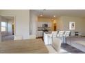 Open-concept kitchen with a center island, granite countertops, stainless steel appliances, and ample cabinet space at 127 N Keatts Winner Ct, Wilson's Mills, NC 27520