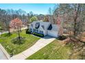 Beautiful neighborhood featuring lush lawns, mature trees and traditional-style homes at 136 Mayflower Way, Clayton, NC 27527