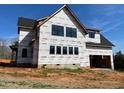 A two-story home under construction has multiple windows and an attached two-car garage at 171 Dairymont Dr, Pittsboro, NC 27312