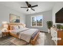 Cozy bedroom with ample natural light, fan, neutral decor, and comfortable furnishings at 2012 Castana Ct, Willow Springs, NC 27592
