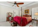 Traditional style bedroom with a four poster bed, side table and decorative elements at 203 Streamside Dr, Sanford, NC 27330