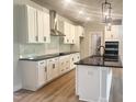 Modern kitchen featuring sleek countertops, stainless steel appliances, and a stylish island at 207 Golfview Ave, Benson, NC 27504