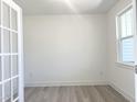 Home office featuring light wood floors, white walls, and a window with natural light at 245 Golfview Ave, Benson, NC 27504