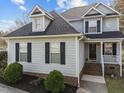 Beautiful exterior of a well-maintained two-story home with symmetrical design and welcoming entrance at 2760 Clifton Ave, Creedmoor, NC 27522