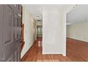 Inviting foyer with hardwood floors leading to a bright and spacious living area at 3207 Coachmans Way, Durham, NC 27705