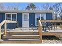 Cozy deck features a seating area, ideal for relaxing outdoors at 352 Leonard Rd, Louisburg, NC 27549