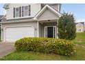 Close up of a beautiful home with a two car garage and a manicured lawn at 4038 Patriot Ridge Ct, Raleigh, NC 27610