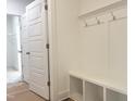 A well-organized mudroom features built-in bench seating, cubbies, and coat hooks for easy storage at 63 Tee Time Ter, Benson, NC 27504