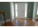 Welcoming entryway with hardwood floors and a bright front door with sidelights at 701 Marjam Ln, Fuquay Varina, NC 27526