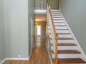 Spacious foyer featuring beautiful wood-look floors and an elegant staircase at 701 Marjam Ln, Fuquay Varina, NC 27526
