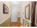 Bright foyer with hardwood floors and elegant decorative mirror at 7329 Blannie Farms, Willow Springs, NC 27592