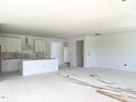Unfinished interior with white walls and cabinets, offering a blank canvas to customize to your liking at 79 Tee Time Ter, Benson, NC 27504