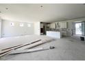 Unfinished interior showcasing an open concept layout, with a kitchen and blank canvas to customize to your liking at 79 Tee Time Ter, Benson, NC 27504