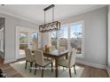 Elegant dining room with large windows providing natural light and a view of the outdoors at 934 Woodland Rd, Creedmoor, NC 27522