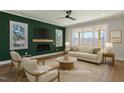 Bright living room with fireplace, hardwood floors, and neutral tones creating a cozy atmosphere at 934 Woodland Rd, Creedmoor, NC 27522