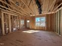 Interior framing showcasing open layout, stud walls, subfloor and natural light from windows at 9600 Stallings Rd, Spring Hope, NC 27882