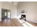 Spacious living room featuring a fireplace, light walls, wood floors, and natural light at 100 Wiley Oaks Dr, Wendell, NC 27591