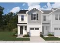 New townhome with gray siding, white accents, a garage, and professionally landscaped yard at 11 Silver Pne Dr, Angier, NC 27501
