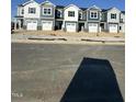 Row of newly constructed townhomes featuring multiple units with individual garages and modern exteriors at 11 Silver Pne Dr, Angier, NC 27501