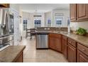 Open kitchen featuring stainless steel appliances, tile floors, and a breakfast nook area at 1176 Andrews Ct, Creedmoor, NC 27522