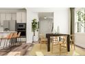 Elegant dining area with stylish furniture, hardwood floors, and natural light at 1217 Coral Cay Bnd, Wake Forest, NC 27587