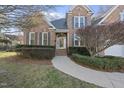 Beautiful brick home with well-maintained landscaping, walkway and shutters at 1301 Merrington Cir, Raleigh, NC 27615