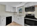 Updated kitchen with stainless appliances, modern cabinets, and ample counter space at 2080 Saint Paul Church Rd, Roxboro, NC 27574