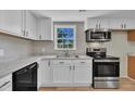 Updated kitchen with stainless appliances, modern cabinets, and ample counter space at 2080 Saint Paul Church Rd, Roxboro, NC 27574