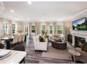 Spacious living and dining areas feature hardwood floors, a fireplace, and an abundance of natural light at 210 Shingle Oak Rd, Wake Forest, NC 27587