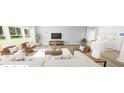 Bright living room with modern furnishings, hardwood floors and large windows at 293 Beacon Dr, Pittsboro, NC 27312