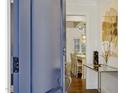 Foyer with a view into the dining room, hardwood floors, and elegant decor at 321 Nottingham Dr, Chapel Hill, NC 27517