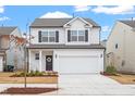 Well-maintained two-story home featuring a two-car garage and fresh landscaping, perfect for curb appeal at 3504 Triad Ct Ct, Raleigh, NC 27604