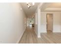 Spacious hallway with light wood floors, neutral walls, and recessed lighting at 396 Hopewell Branch Ct, Smithfield, NC 27577