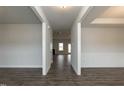 Bright entryway featuring wood flooring, neutral walls, and open access to the living spaces at 410 Hopewell Branch Ct, Smithfield, NC 27577