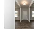 Spacious entryway with wood floors, leading to open rooms and natural light at 410 Hopewell Branch Ct, Smithfield, NC 27577